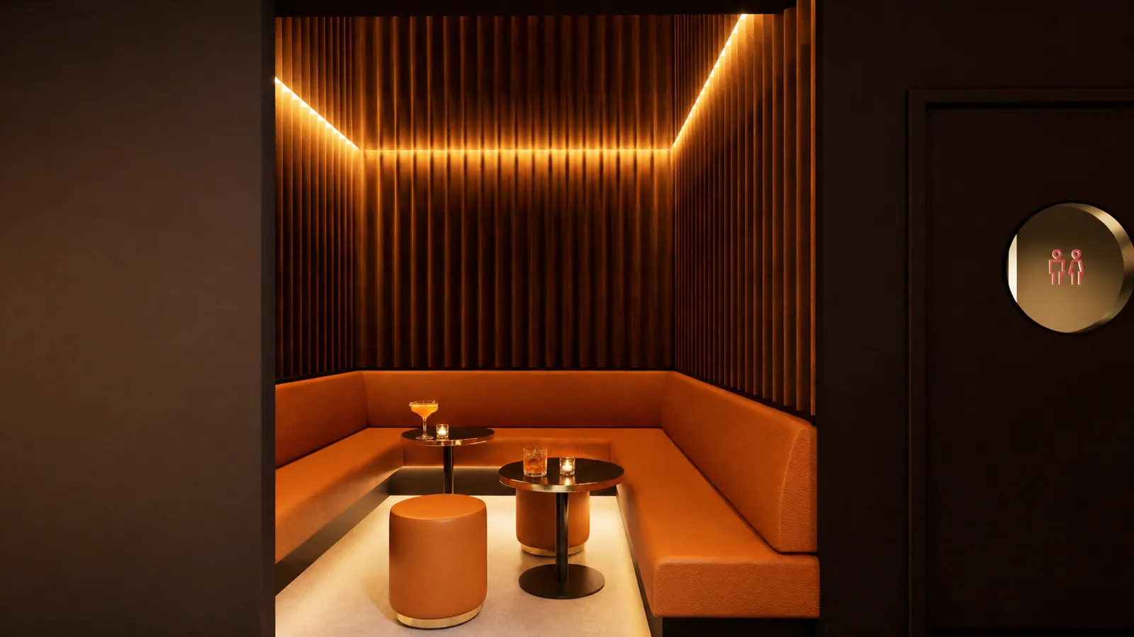 A fluted timber snug with burnt orange leather seating